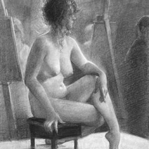 A nude model poses in a studio space surrounded by student-artists.
