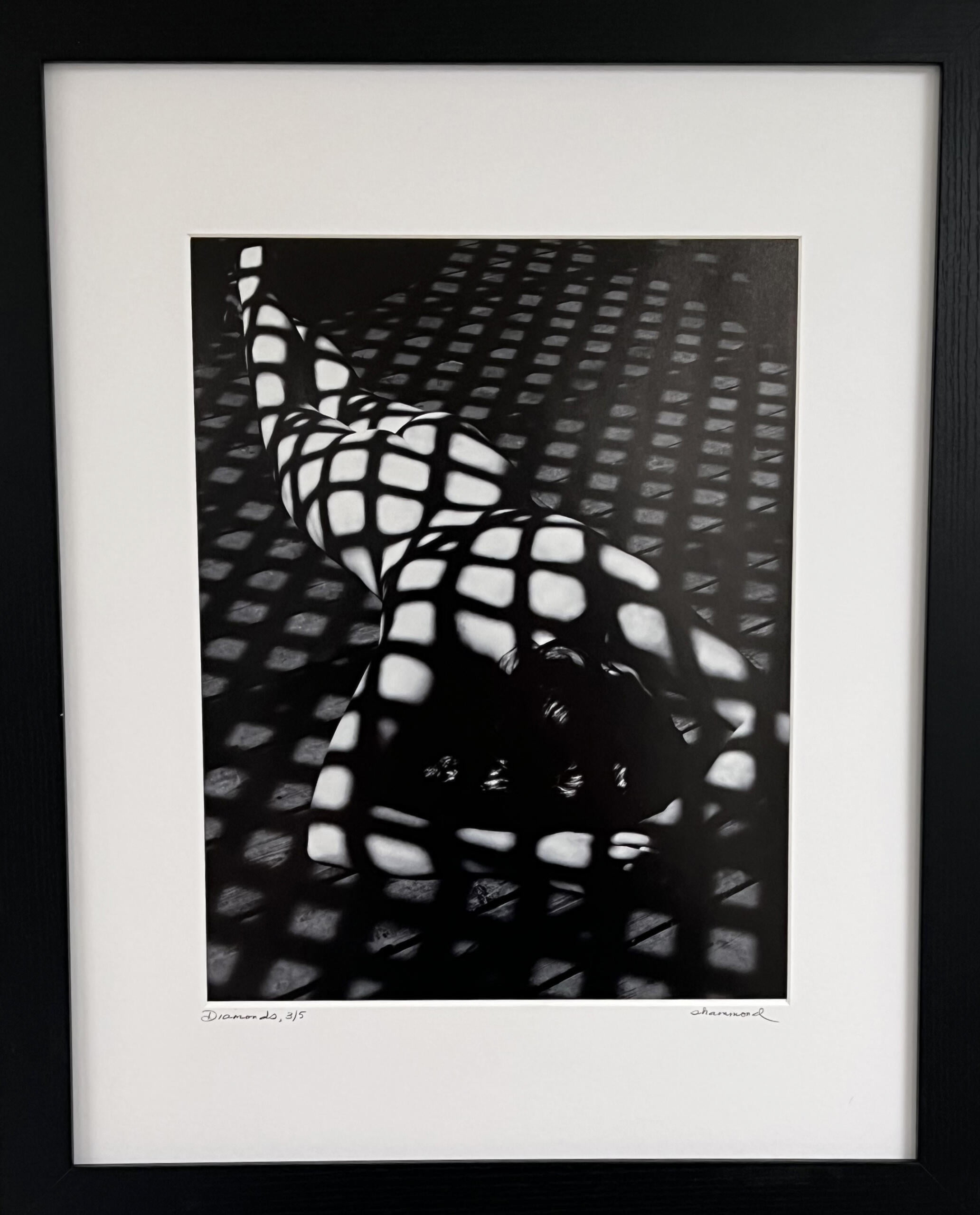 "Diamonds" by Susan Hammond in a white matte with simple black frame.
