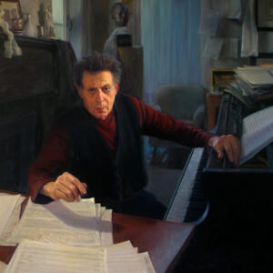 Middle aged man with hair gelled up with one hand on top of a piano and the other hovering above piles of sheet music on the adjacent, perpendicular desk. The desk appears to be lamp lit, as the rest of the room, which holds some furniture and several small statues, is quite dim.