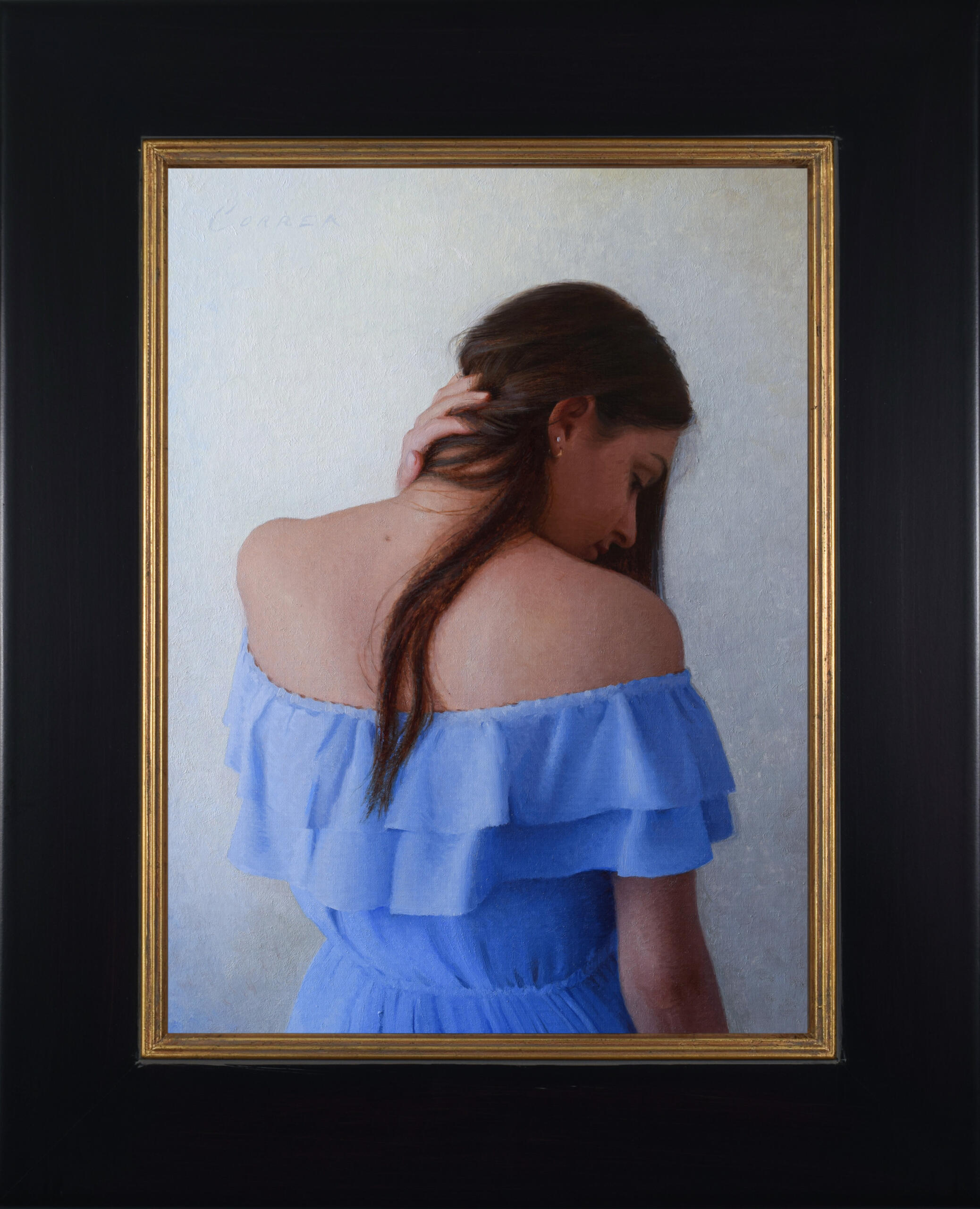 "Young woman in blue" in a wide, black frame with a stripe of gold along the inner edge.