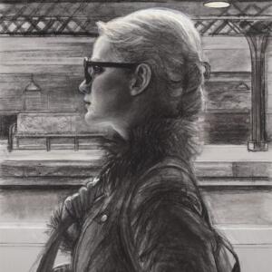 Black and white: a woman with glasses, a feathery scarf, and a large handbag on a subway platform.
